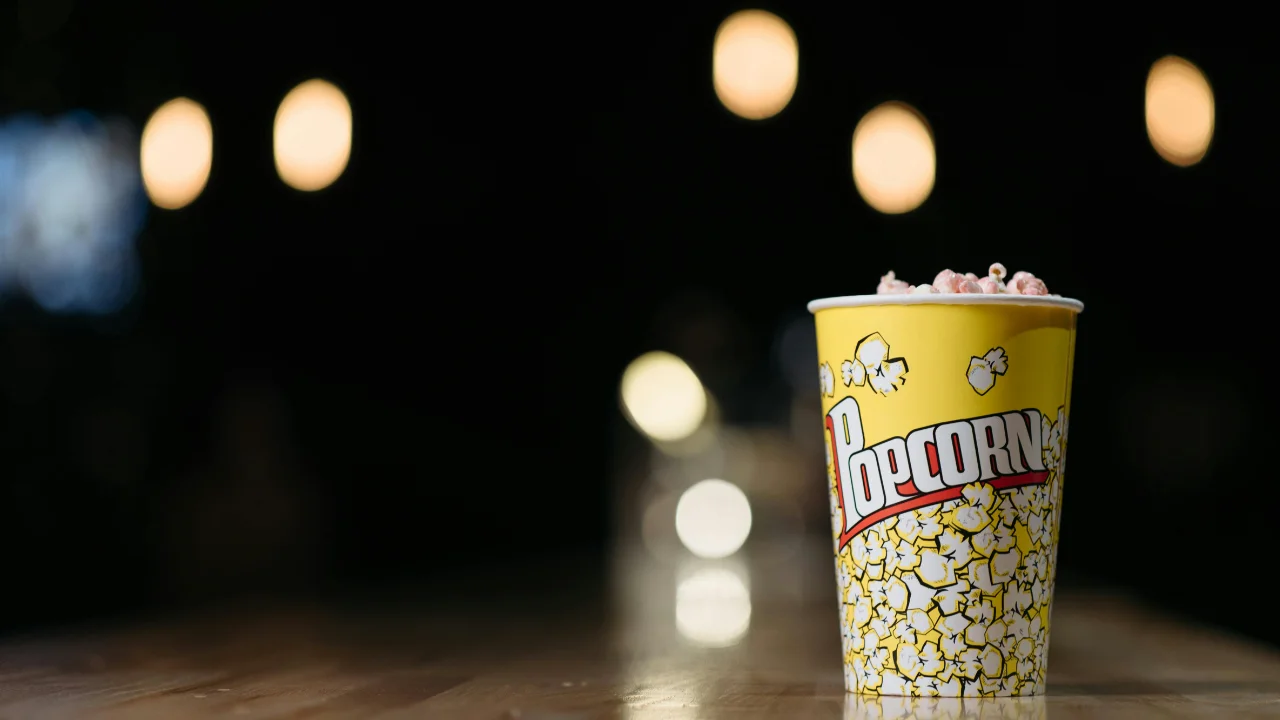 Photo by [Pavel Danilyuk](https://www.pexels.com/photo/a-white-and-yellow-disposable-cup-of-popcorn-7234413/)